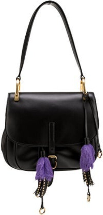 Prada Shoulder Bag Nero City Calf Leather Gold-Tone Hardware Flat Handle & Single Shoulder Strap Fringe, Leather, Studded, Fur & Tassel Accents Dual Exterior Pockets Logo Jacquard Lining & Single Interior Pocket Flap & Buckle Closures at Front, Pull-Through Closure at Top Includes Dust Bag, Authenticity Card, Clochette & Additional Embellishments Unfortunately, due to restrictions, this item may not be eligible for shipping in all areas.