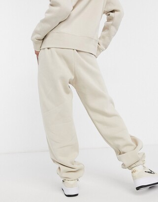 Nike mini swoosh oversized sweatpants in cream - CREAM - ShopStyle  Activewear Pants
