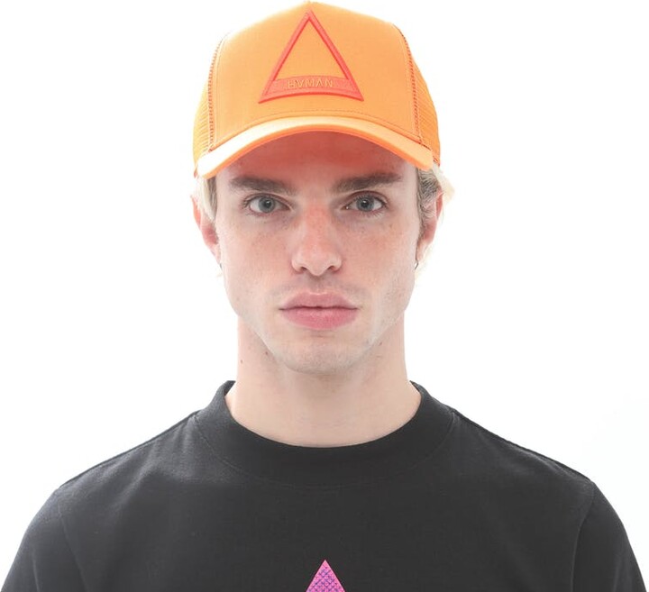 HVMAN CHOSEN TO PREVAIL Triangle Logo Mesh Trucker Cap In Apricot
