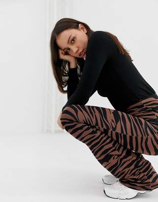 ASOS Tall DESIGN Tall flare leggings in dark tiger print-Multi