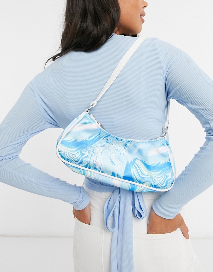 ASOS DESIGN elongated 90s shoulder bag in blue marble print ShopStyle