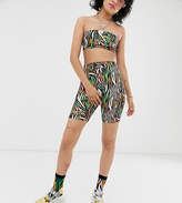 Thumbnail for your product : ASOS Design Disney The Lion King x DESIGN legging shorts two-piece in zebra print with logo embroidery
