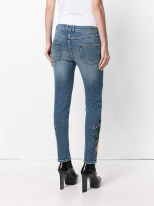 Alexander McQueen animal patch skinny jeans