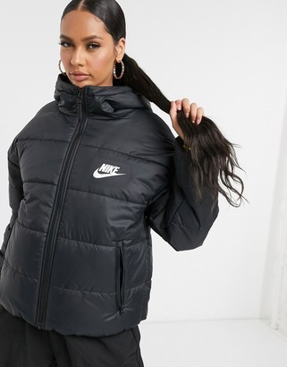Nike padded jacket with back swoosh in black - ShopStyle