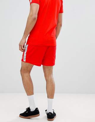 Puma shorts with taped side stripe in red Exclusive at ASOS