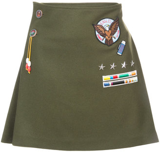 Mira Mikati appliquéd badge pleated skirt