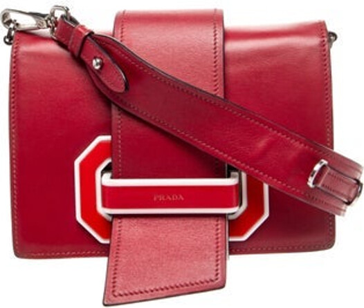 Prada Crossbody Bag Red City Calf Leather Silver-Tone Hardware Single Shoulder Strap Leather Trim Embellishment Logo Jacquard Lining & Single Interior Pocket Flap & Fold-In Flap Closures at Front Unfortunately, due to restrictions, this item may not be eligible for shipping in all areas.