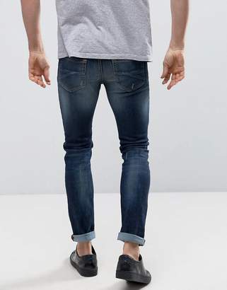 Benetton Skinny Jeans in Washed Denim With Distressing