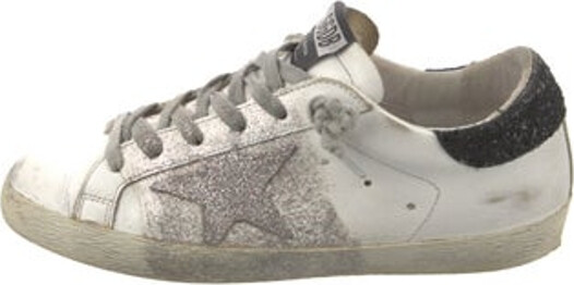 Golden Goose Superstar Low Top Sneakers Black, Silver & White Leather Colorblock Pattern Rubber Trim Distressed & Glitter Accents Round-Toes Lace-Up Closure at Uppers Includes Dust Bag Designer