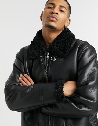 ASOS DESIGN faux shearling aviator jacket in black with buckle detail -  ShopStyle