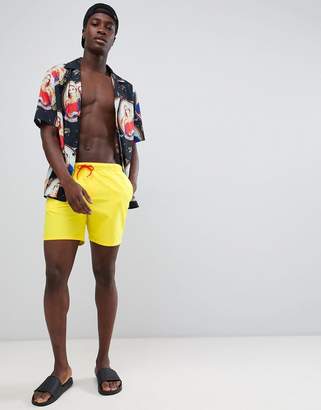 ASOS Design DESIGN swim shorts in retro purple & yellow mid length 2 pack multipack saving