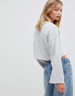 NATIVE YOUTH Wide Sleeve Crop Top With Raw Edge