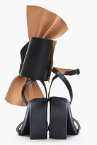 Thumbnail for your product : Maison Martin Margiela 7812 MAISON MARTIN MARGIELA Black leather asymmetric bow sandals