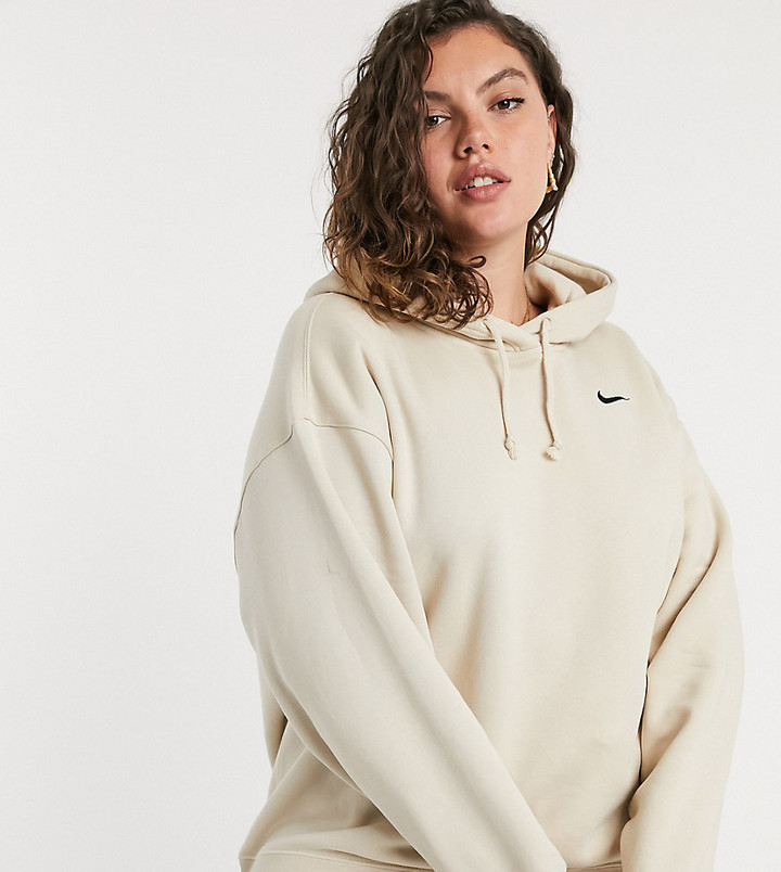 Nike Plus trend fleece hoodie with mini swoosh in beige - ShopStyle