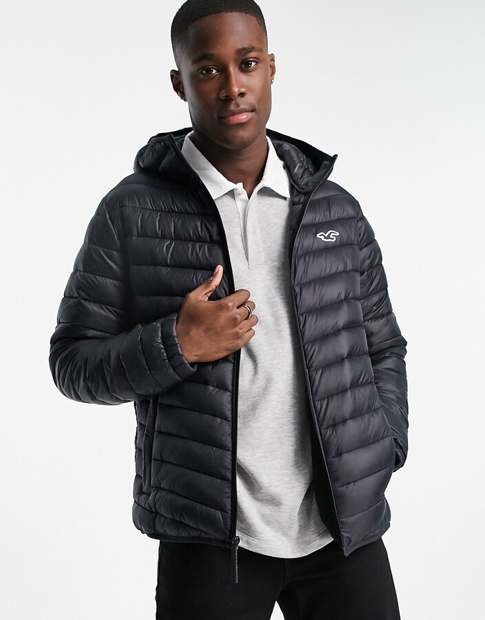 Hollister icon/tape logo hooded narrow channel lightweight puffer jacket in  black - ShopStyle
