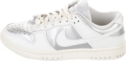 Nike Leather Low Top Athletic Sneakers Silver & White Rubber Trim Round-Toes with Embroidered Accent Lace-Up Closure at Uppers Unfortunately, due to restrictions, this item may not be eligible for shipping in all areas.