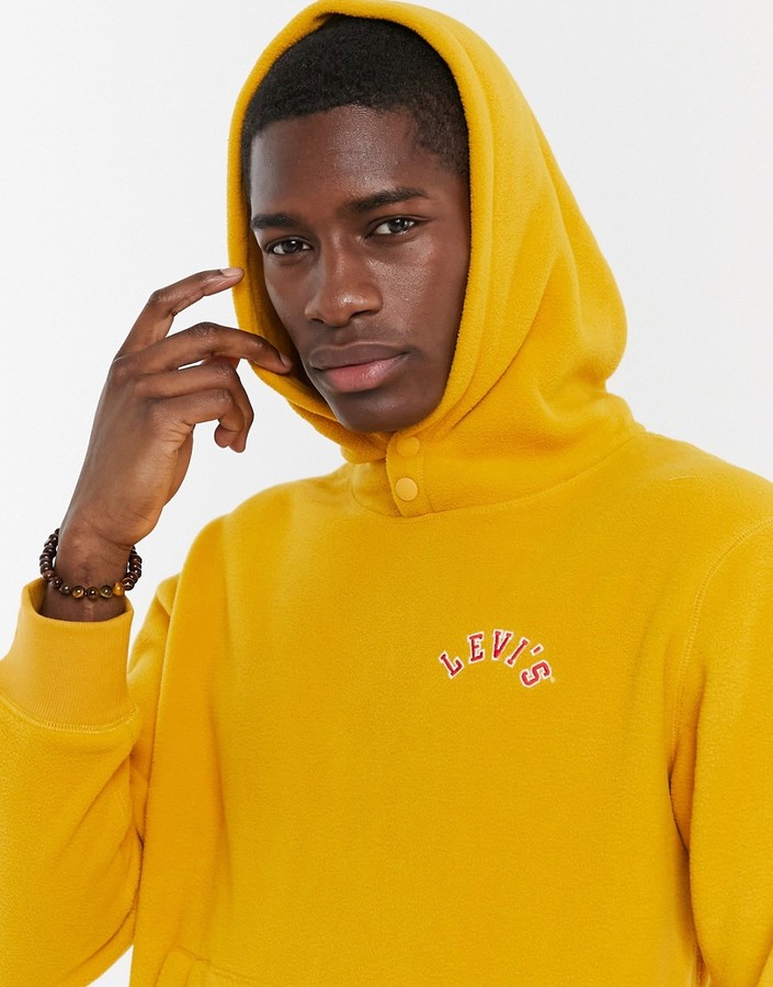 Levi's logo polar fleece hoodie in golden yellow - ShopStyle