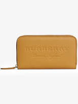 Burberry embossed leather ziparound wallet