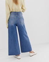 Thumbnail for your product : ASOS DESIGN premium wide leg jeans in mid wash blue