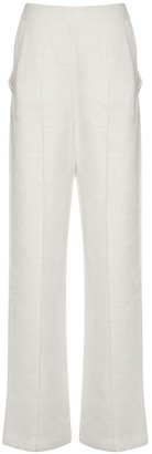 white linen flared trousers