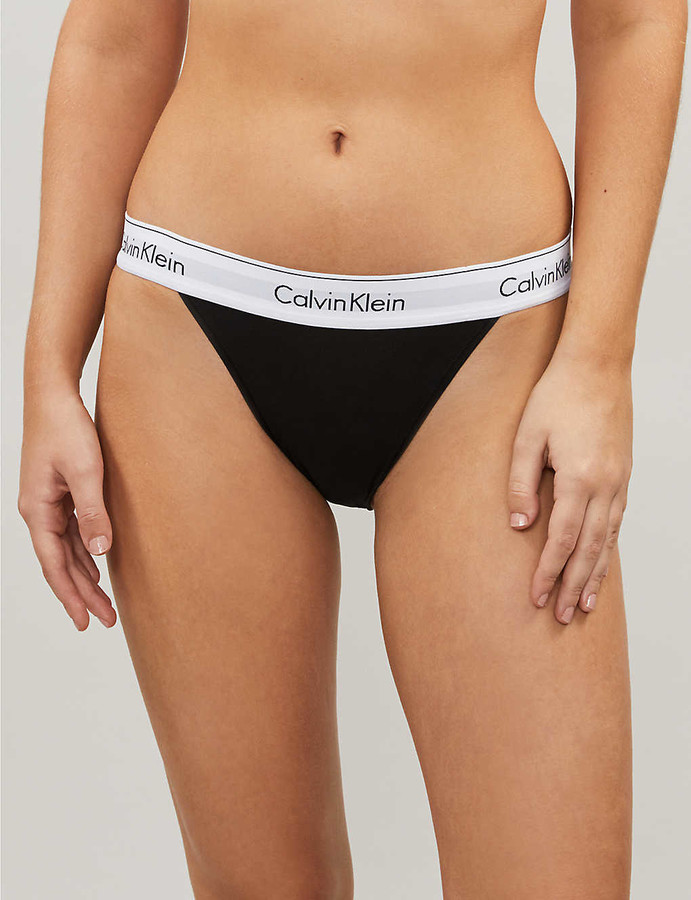 Calvin Klein Underwear 3 Pack Thong in Light Caramel, Power Plum, & Black