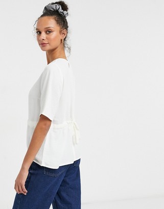 JDY Tina short sleeve peplum blouse with bow back detail in cream