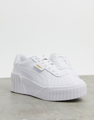Puma Cali Wedge sneakers in white and black - ShopStyle