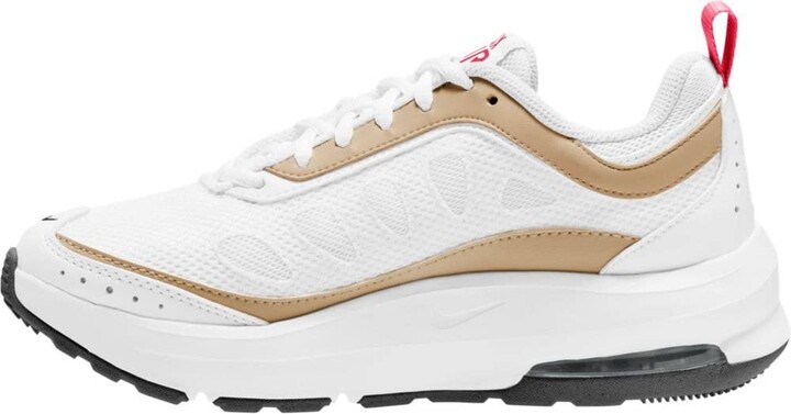 white and gold nike trainers