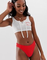 Thumbnail for your product : ASOS Tall ASOS DESIGN Tall 'beach bunny' jersey crop top with lace up detail