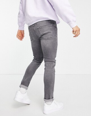 Topman stretch skinny jeans with rip and repair in grey - ShopStyle