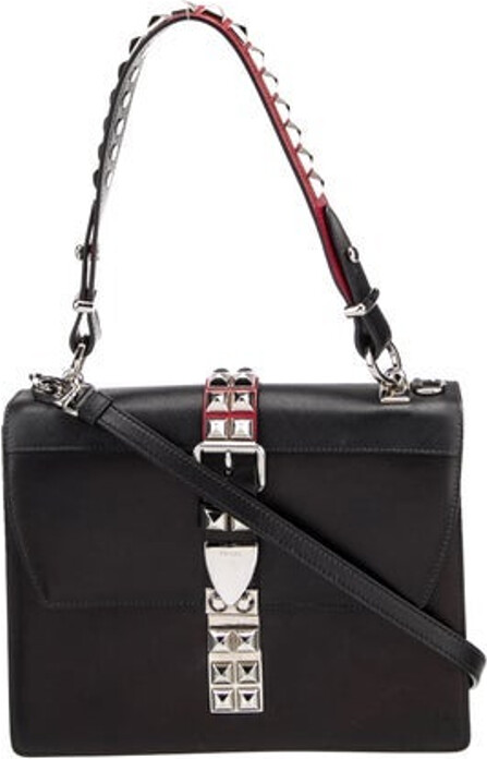 Prada Shoulder Bag Nero City Calf Leather Saffiano Leather Silver-Tone Hardware Flat Handle & Single Adjustable Shoulder Strap Leather & Studded Accents Single Exterior Pocket Leather Lining & Dual Interior Pockets Flap & Push-Lock Closures at Front Includes Dust Bag Unfortunately, due to restrictions, this item may not be eligible for shipping in all areas.