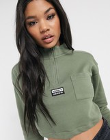 Thumbnail for your product : adidas high neck cropped sweat in khaki