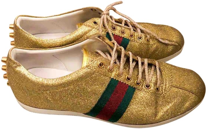 gucci gold sneakers