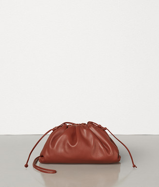 rust coloured clutch bag
