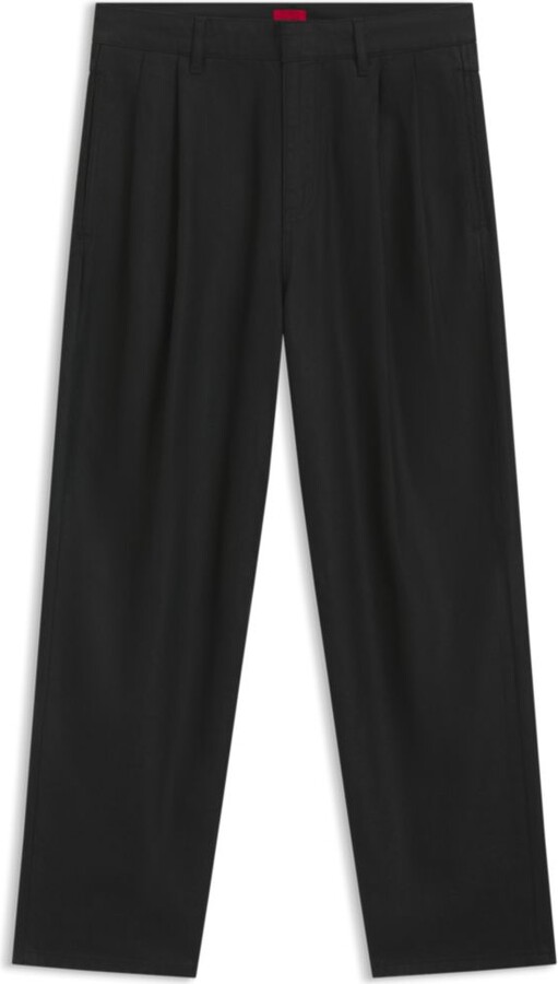 Relaxed-fit jeans in black waxed denim