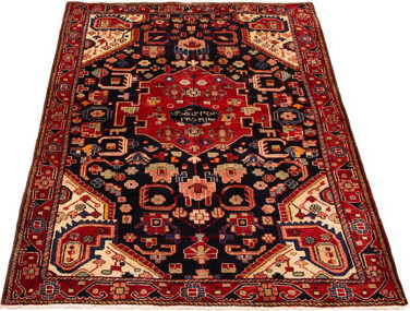 Bungalow Rose Splendid piece of work that is woven with a re-interpretation of village Persian designs. The vintage and distressed look make this hand-knotted wool