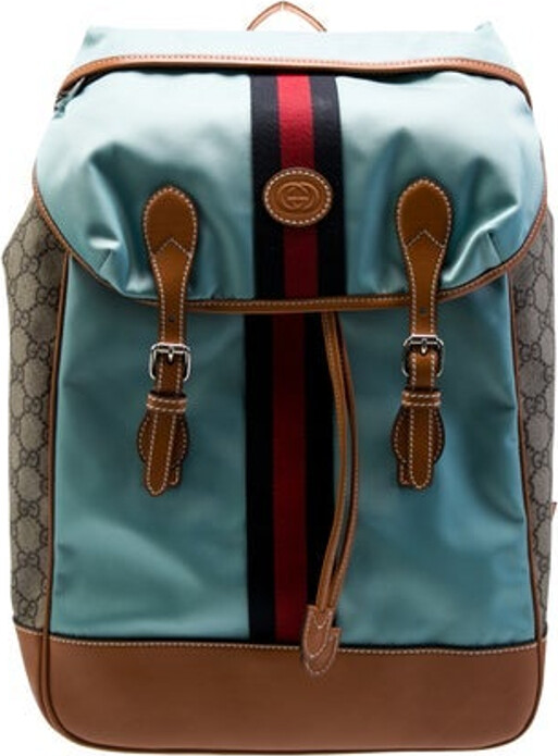 Gucci Backpack Neutrals GG Supreme, Web Accent & Interlocking G Logo Silver-Tone Hardware Leather & Nylon Trim Flat Handle & Dual Adjustable Shoulder Straps Leather Trim Embellishment & Single Exterior Pocket Canvas Lining & Dual Interior Pockets Drawstring Closure at Top