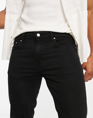 ASOS DESIGN skinny jeans in black with knee rips