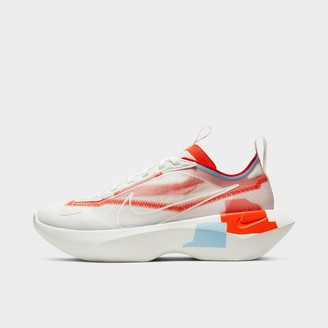 white nike shoes with orange swoosh