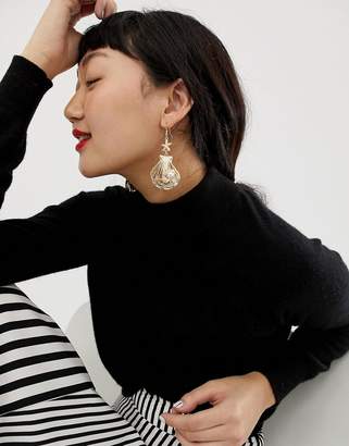 ASOS Design DESIGN earrings in sea shell design with pearl in gold