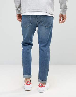 ASOS Tapered Jeans In Vintage Mid Wash Blue