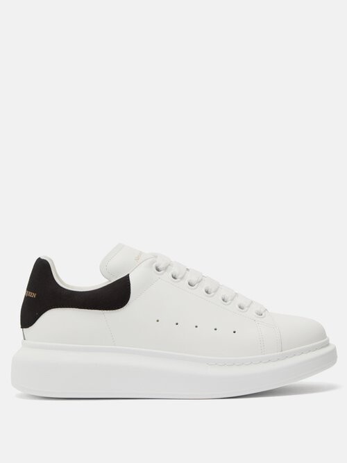 black sneakers with black soles