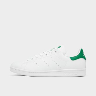 white adidas shoes with green back