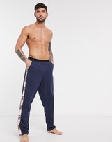 Thumbnail for your product : ASOS DESIGN lounge pyjama bottoms in navy with branded side panels