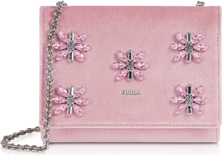 Furla Viva Mini Pochette crafted in Suede with crystal floral  embellishments plays on the timelessness of the chain bag with a sliding  strap that goes from shoulder to crossbody. Featuring flap top