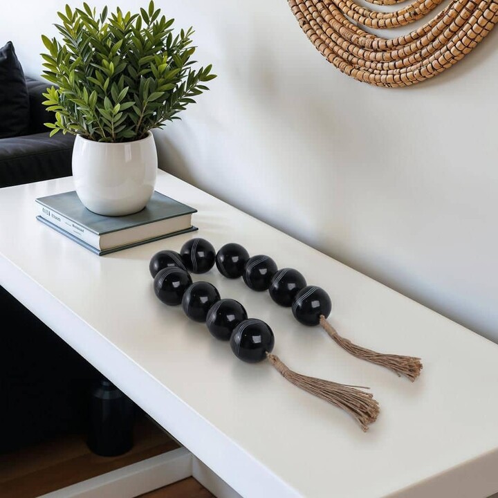 Liv & Skye Black 49 in. x 3 in. Resin Round Carved Bead Garland