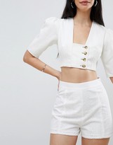 Thumbnail for your product : ASOS DESIGN Broderie Shorts with Pom Pom Trim
