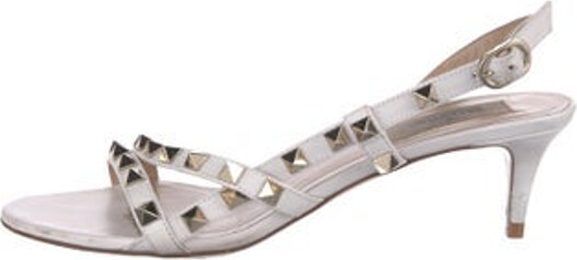 Valentino Leather Slingback Sandals White Rockstud Accents Studded Accents Straps & Buckle Closure at Ankles Includes Dust Bag Unfortunately, due to restrictions, this item may not be eligible for shipping in all areas.