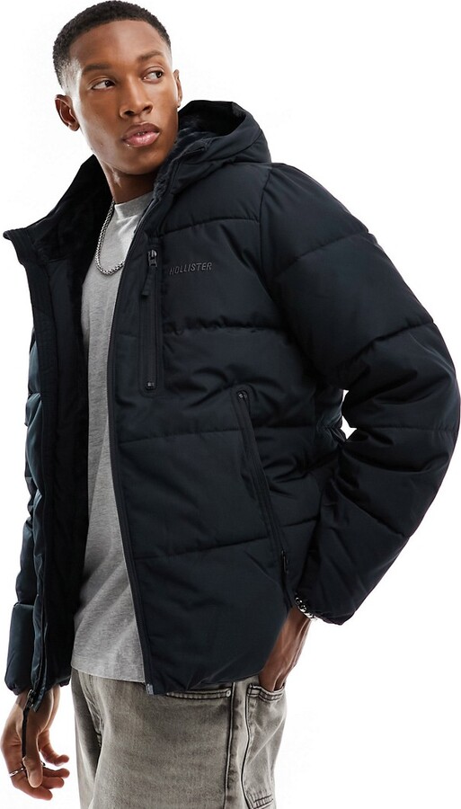Hollister wide channel cozy hooded puffer jacket in black - ShopStyle