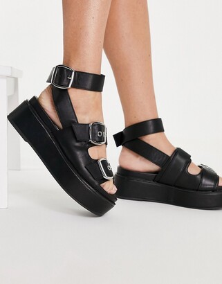 ASOS DESIGN Wide Fit Thistle chunky buckle flatform sandal in black -  ShopStyle